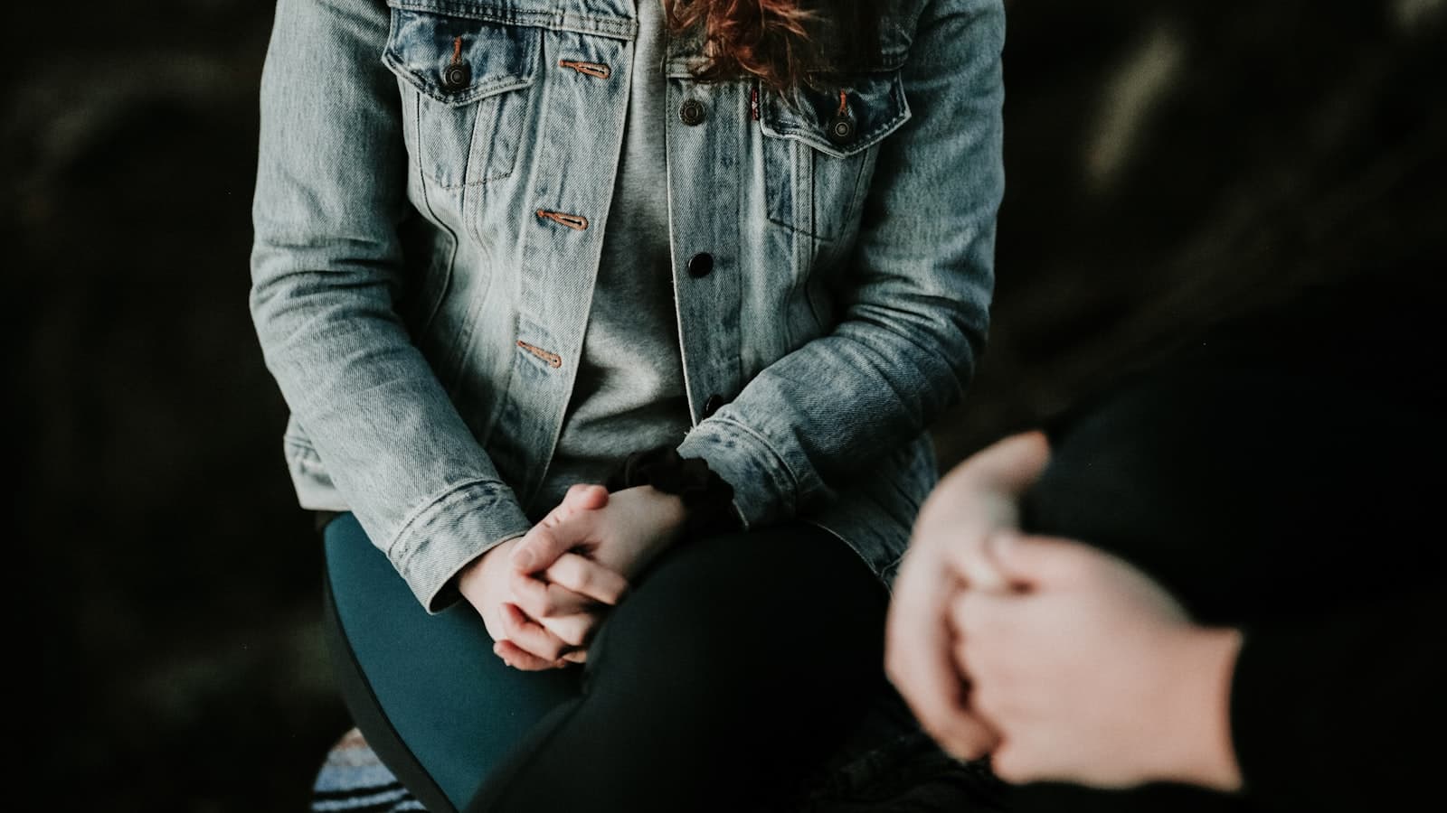 Two people sitting together in a calm counselling session